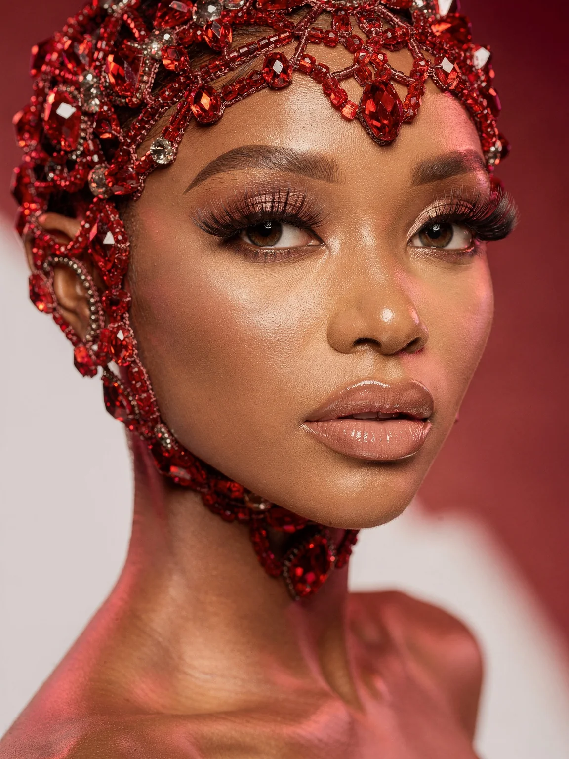 Beauty portrait with a red crystal-beaded headpiece